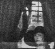 The interest must have varied as shown by the look on this woman's face still seated in the bus. She's and her bus-mates have traveled from Harlingen, Mission and McAllen. Unpaved roadways were dusty, the bus was not airconditioned, and windows were cranked down. (Zoomed in view from the Excursion Bus image above.)